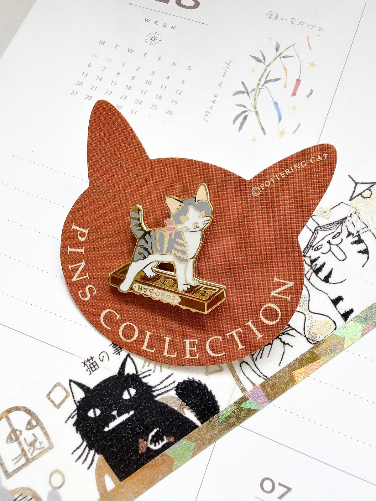 Pottering Cat | Abacus Scratcher Enamel Pin | PZ-041